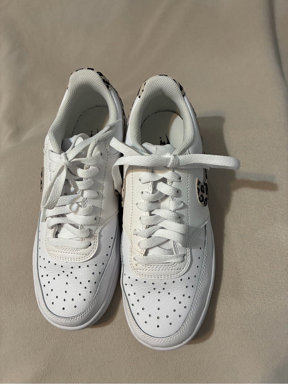 Nike White Women’s Sneakers with Leopard Heel Accent